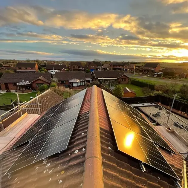 Our work on a roof with solar panels.